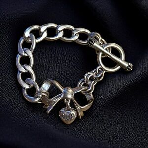 Juicy Couture silver tone puffed heart and bow bracelet